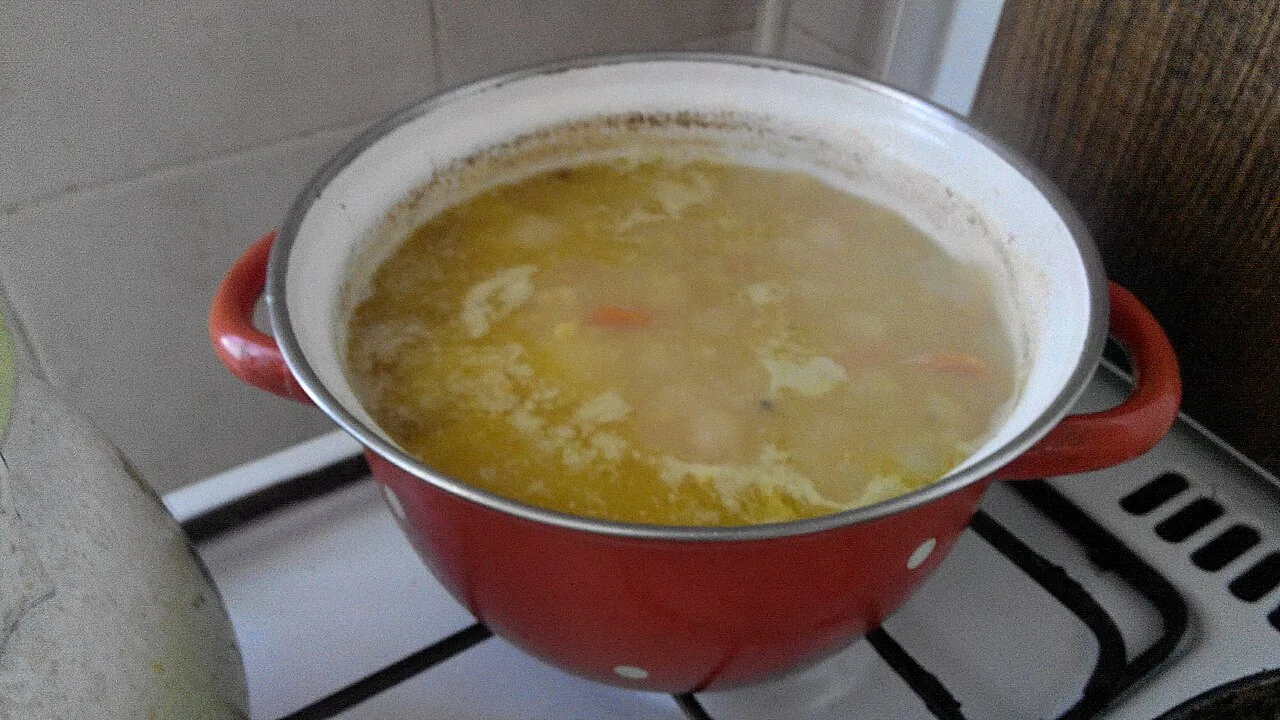 Red lentil soup simmering before blending