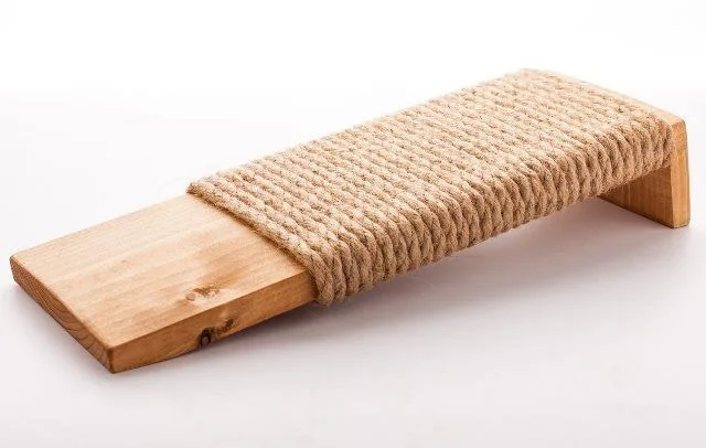 A floor scratching post for a cat, used as a practical alternative to sofa scratching